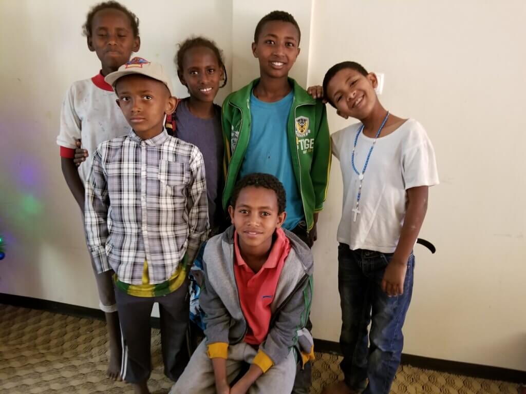 group of kids together smiling